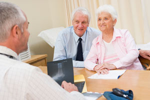 Old Couple Asking Doctor About Risk Factor of PAD