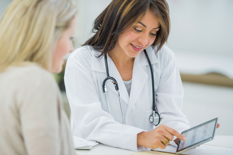 Doctor talking to a patient about varicose veins