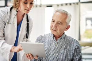 doctor talking to patient about pad