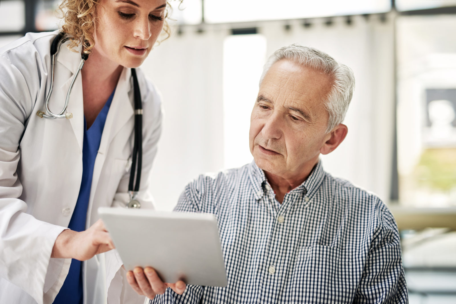 doctor talking to patient about pad