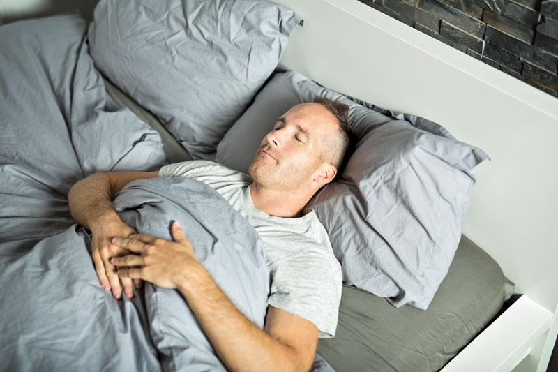 man with varicoceles sleeping