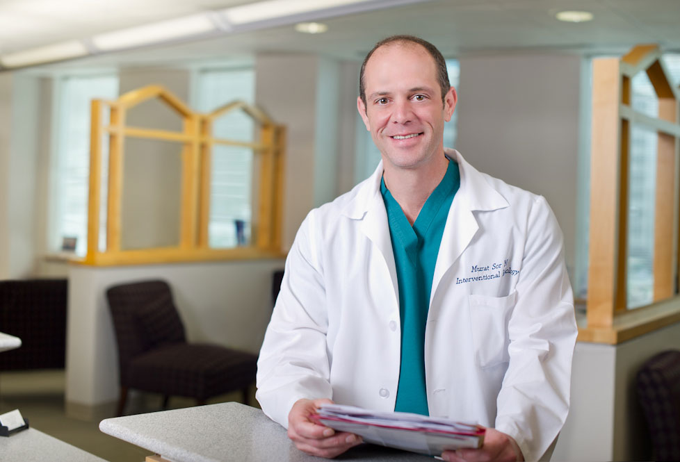 Dr. Murat Sor in a lab coat, HealthQare Services