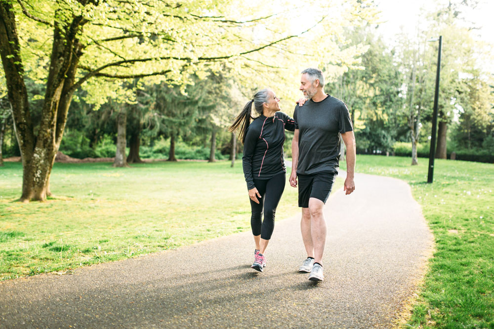 a man and women walking, varicose veins