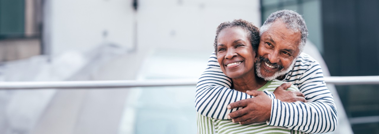 A man hugging a woman