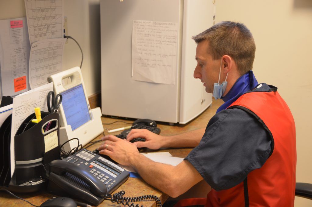 Image of a Doctor using a device at, Providence Access Care