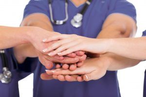 Oath To Treat the Patient, caregiver hands
