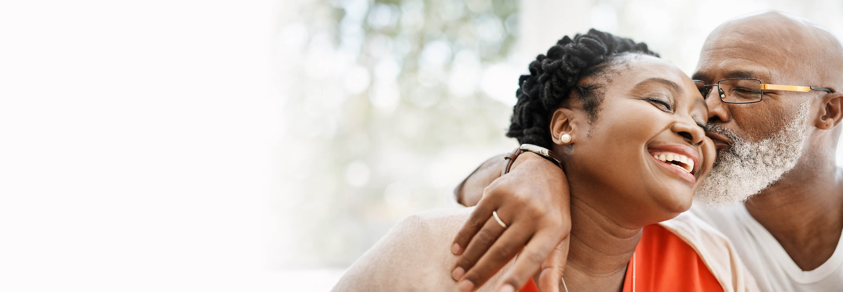 A man kissing a woman on the cheek