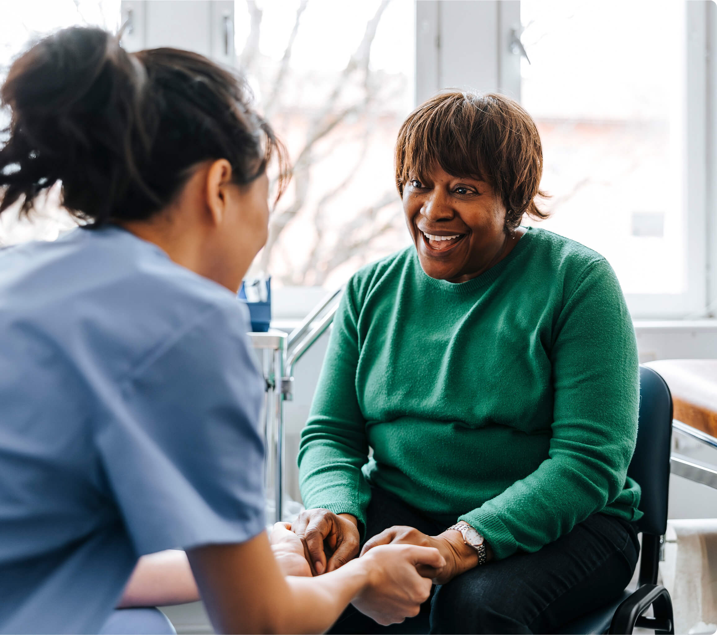 A woman and doctor discussing a varicose vein procedure